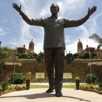 A 9-metre bronze statue of Nelson Mandela is unveiled as part of the Day of Reconciliation Celebrations at the Union Buildings in Pretoria