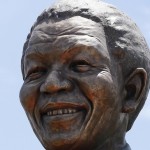 A 9-metre bronze statue of Nelson Mandela is unveiled as part of the Day of Reconciliation Celebrations at the Union Buildings in Pretoria