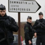 French gendarmes secure the roundabout near the scene of a hostage taking at an industrial zone in Dammartin-en-Goele, northeast of Paris